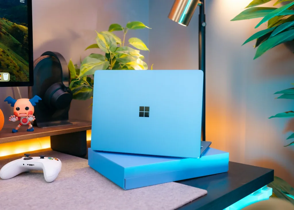 A laptop computer sitting on top of a desk