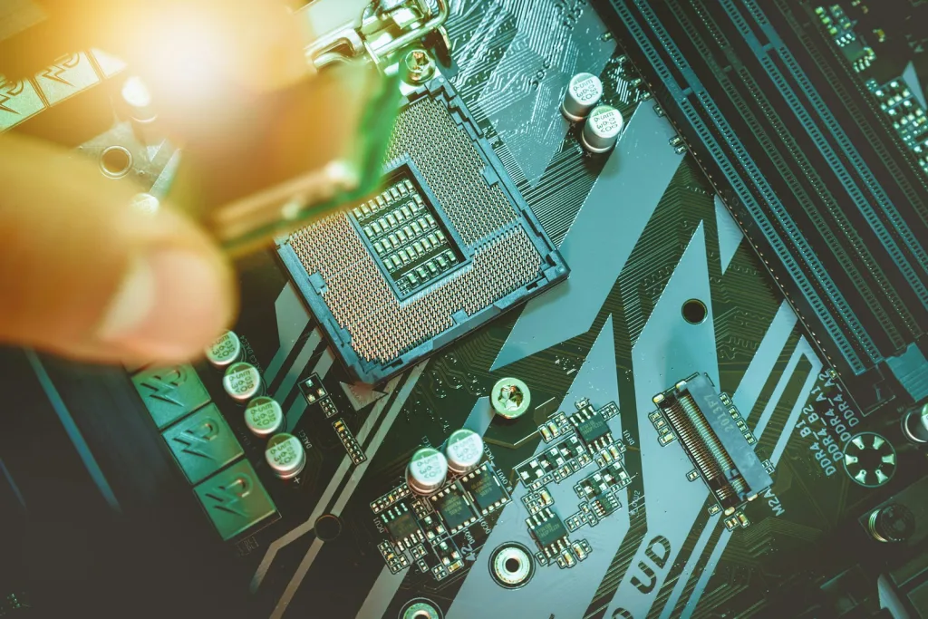 Hand installing a computer processor onto a motherboard.
