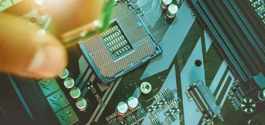 Hand installing a computer processor onto a motherboard.