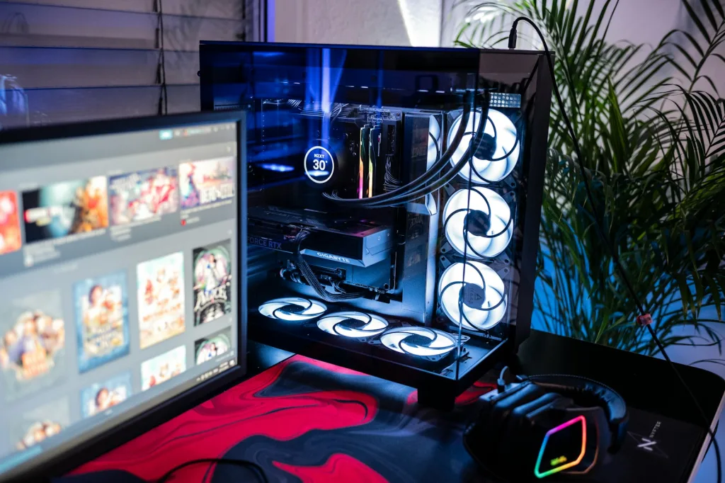 A desktop computer with a large screen and a mouse
