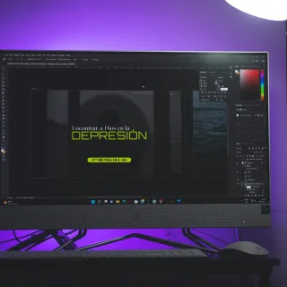 a computer monitor sitting on top of a desk
