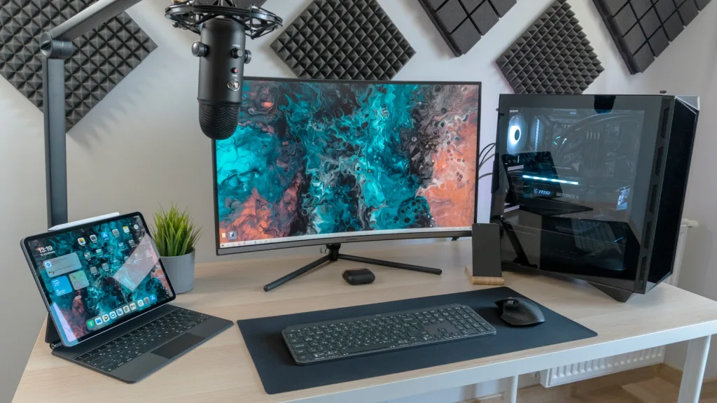 black flat screen computer monitor and black computer keyboard